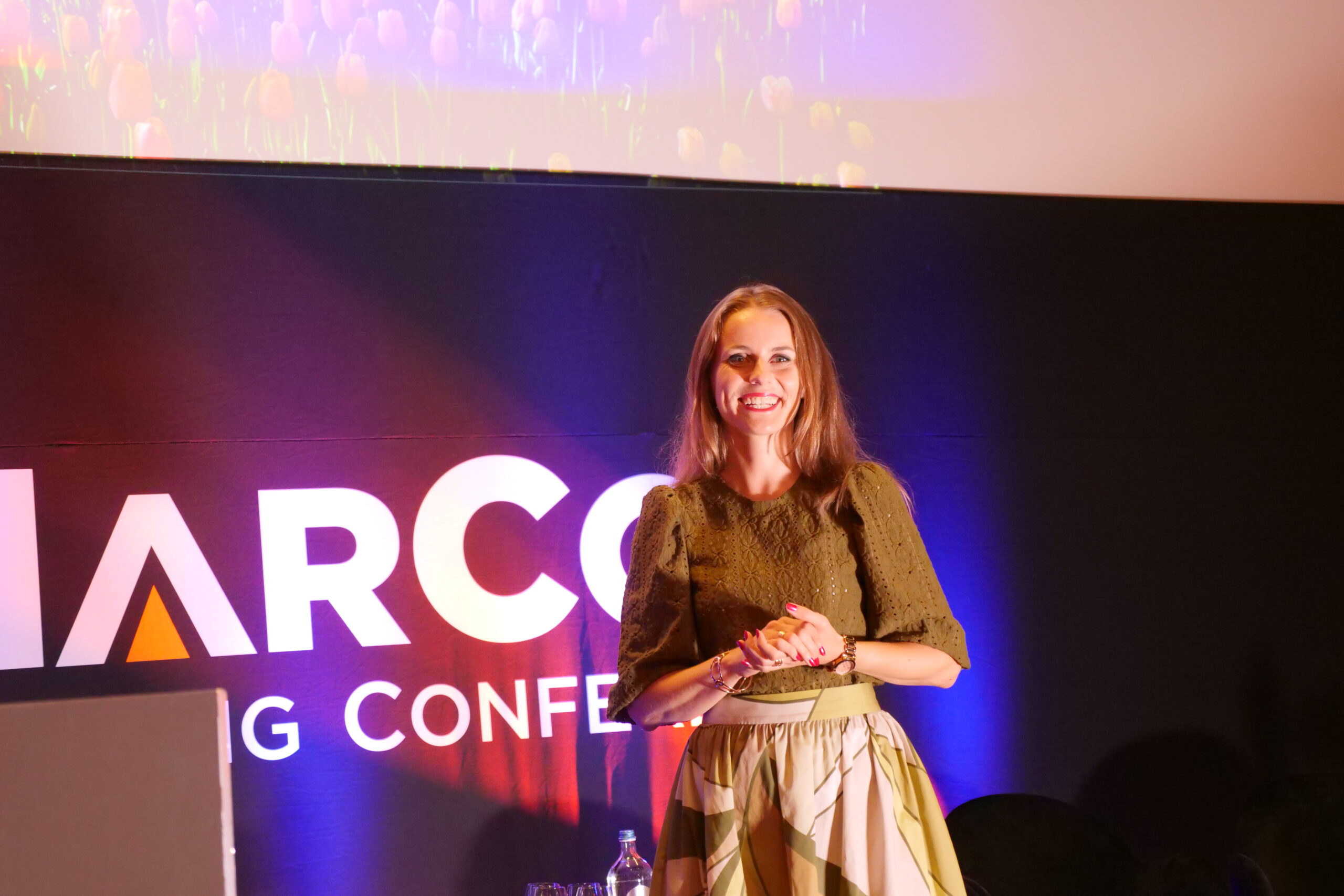 Monika Matuszewska presenting at a conference at ArenA in Amsterdam, the Netherlands.